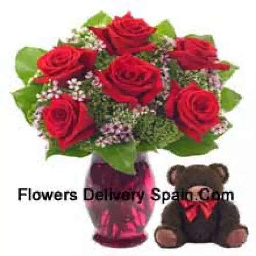 7 Red Roses With Some Ferns In A Glass Vase Along With A Cute 14 Inches Tall Teddy Bear