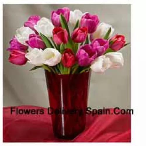 Mixed Colored Tulips With Seasonal Fillers In A Glass Vase - Please Note That In Case Of Non-Availability Of Certain Seasonal Flowers The Same Will Be Substituted With Other Flowers Of Same Value