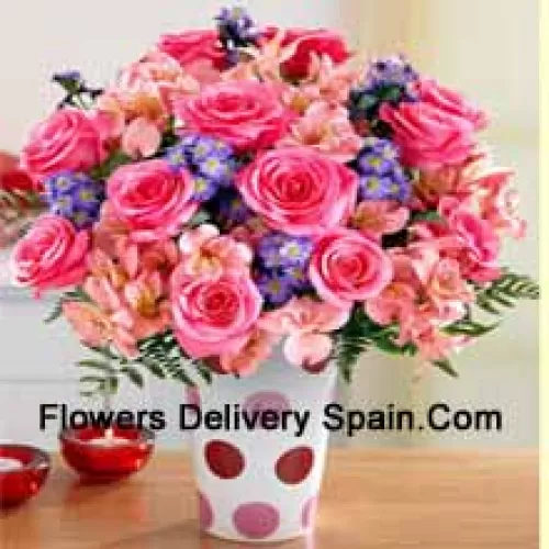 Pink Roses, Pink Orchids And Assorted Purple Flowers Arranged Beautifully In A Glass Vase