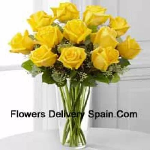 11 Yellow Roses With Some Ferns In A Glass Vase