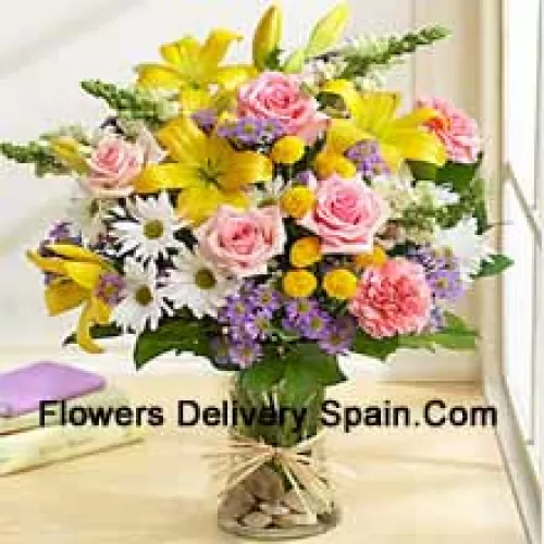 Pink Roses, Pink Carnations, White Gerberas And Yellow Lilies With Seasonal Fillers In A Glass Vase