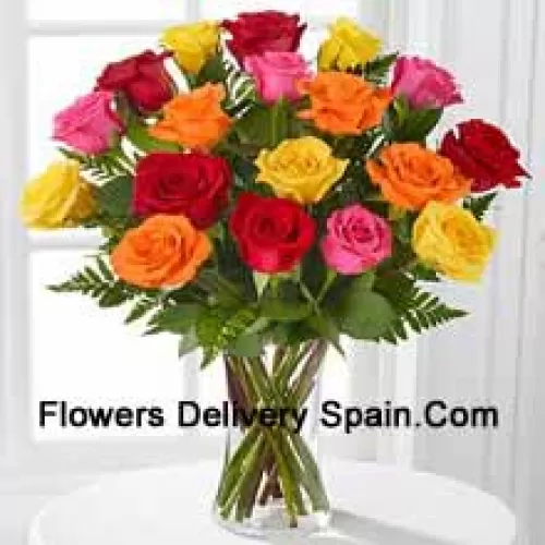 19 Mixed Colored Roses With Seasonal Fillers In A Glass Vase