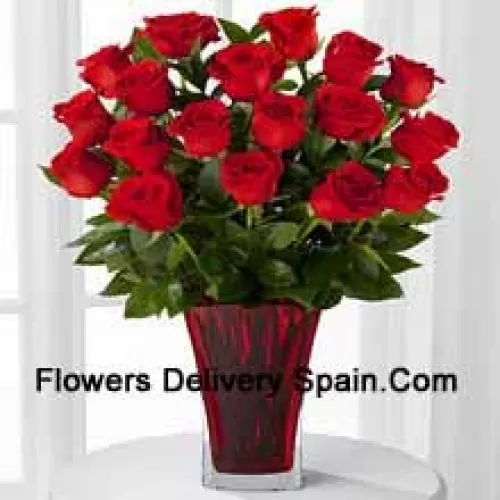 19 Red Roses With Seasonal Fillers In A Glass Vase Decorated With A Pink Bow