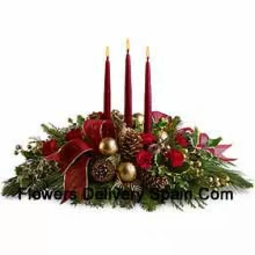 Red miniature carnations, pinecones, golden ornament balls, faux berries and assorted fresh evergreens? accented with a wired ribbon are arranged in a?low dish?with three red taper candles. (Please Note That We Reserve The Right To Substitute Any Product With A Suitable Product Of Equal Value In Case Of Non-Availability Of A Certain Product)